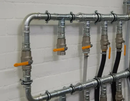 industrial-plumbing-pipes-close-up-wall-40363953